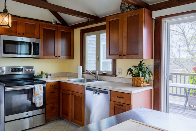 78 Wood Ave, Sandwich, MA 02563 - kitchen featuring appliances with stainless steel finishes, plenty of natural light, a sink, and light countertops
