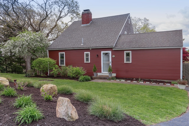 78 Wood Ave, Sandwich, MA 02563 - view of front of property with a chimney, a shingled roof, and a front yard