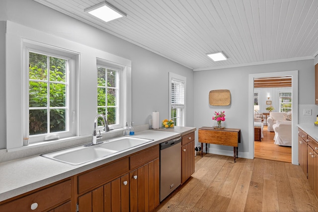 77 Pleasant Rd, West Harwich, MA 02671 - kitchen featuring stainless steel dishwasher, light wood-style floors, light countertops, brown cabinetry, and crown molding