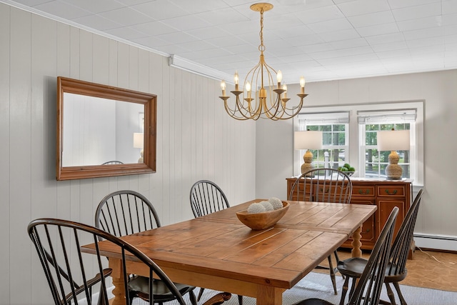 77 Pleasant Rd, West Harwich, MA 02671 - dining space featuring a chandelier, a baseboard radiator, and crown molding