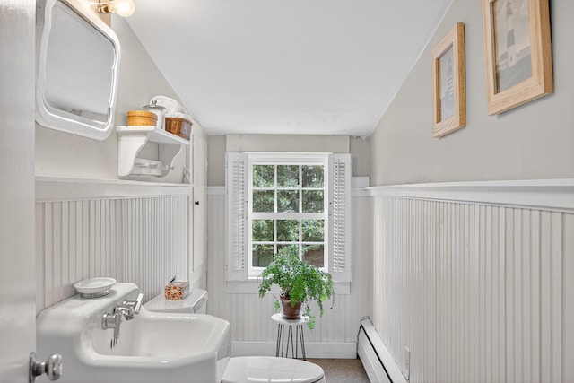 77 Pleasant Rd, West Harwich, MA 02671 - bathroom with wainscoting, baseboard heating, and a decorative wall