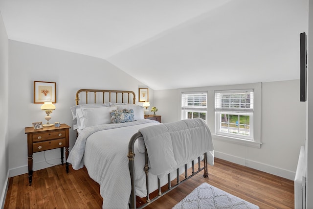 77 Pleasant Rd, West Harwich, MA 02671 - bedroom featuring lofted ceiling and wood finished floors