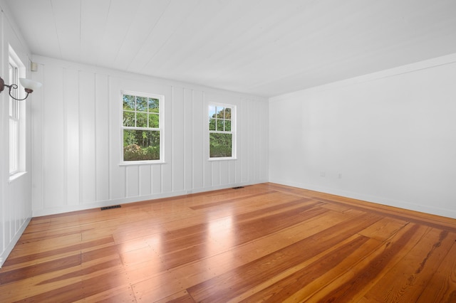 unfurnished room with light wood-type flooring