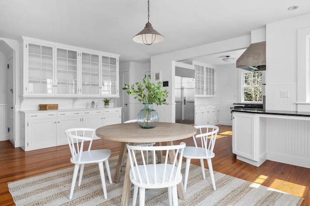 dining area with wood finished floors