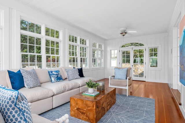 sunroom featuring ceiling fan