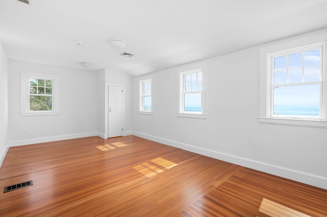 unfurnished room featuring hardwood / wood-style flooring