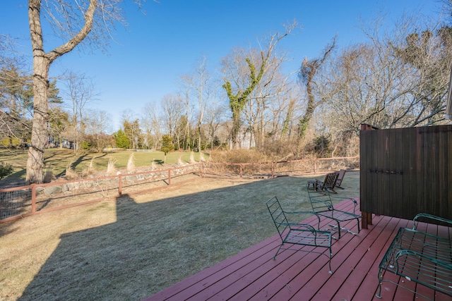 wooden deck with a lawn