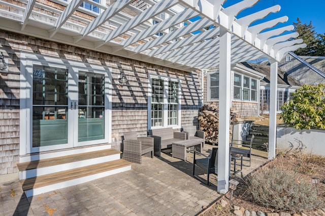 view of patio / terrace with a pergola, an outdoor hangout area, and french doors