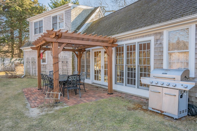 view of patio with french doors, a grill, and a pergola