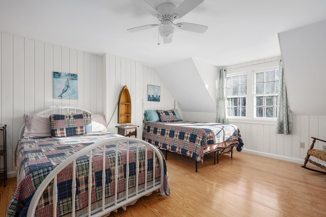 bedroom with ceiling fan and light wood-type flooring