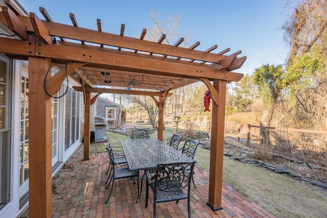 view of patio / terrace with area for grilling and a pergola