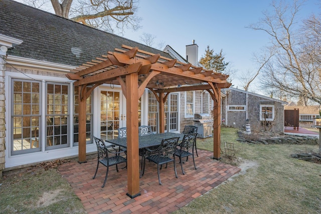 view of patio / terrace featuring area for grilling and a pergola