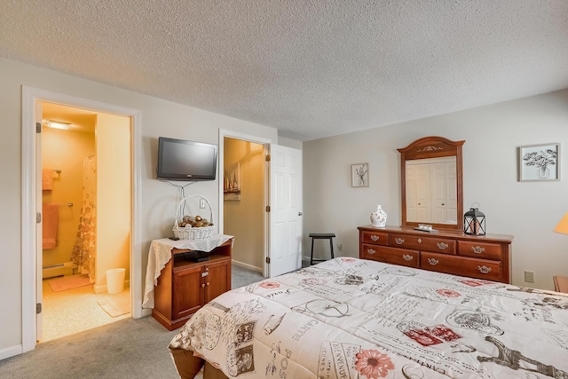 bedroom featuring light carpet, a baseboard heating unit, a textured ceiling, and ensuite bathroom