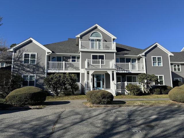 view of front of home with a balcony and a porch