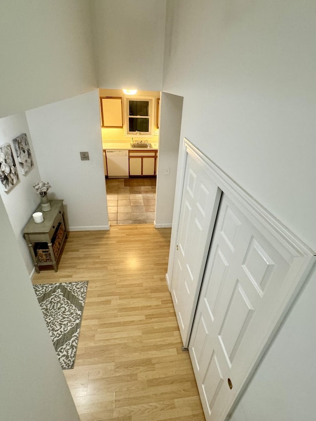 corridor with light hardwood / wood-style flooring