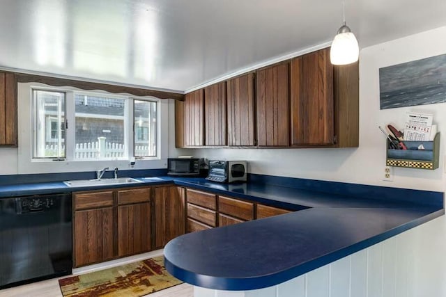 232 Robbins Hill Rd, Brewster, MA 02631 - kitchen featuring decorative light fixtures, a sink, dark countertops, a peninsula, and black appliances
