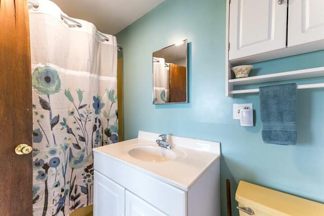 232 Robbins Hill Rd, Brewster, MA 02631 - bathroom with toilet, curtained shower, and vanity