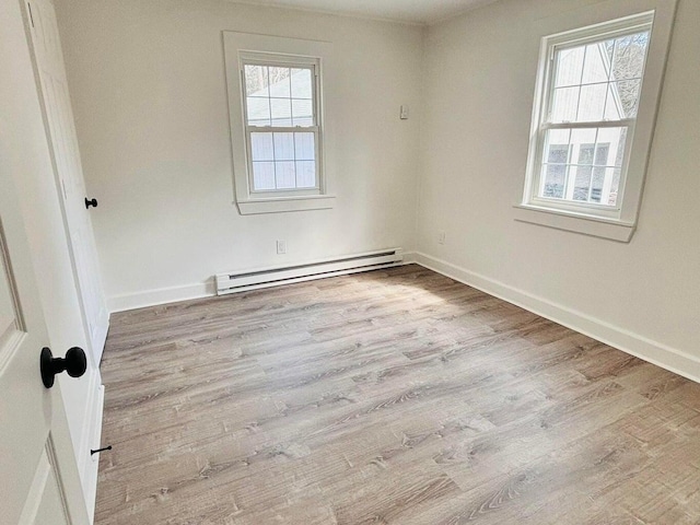 379 Main St, Mashpee, MA 02649 - empty room featuring a baseboard radiator, wood finished floors, and baseboards
