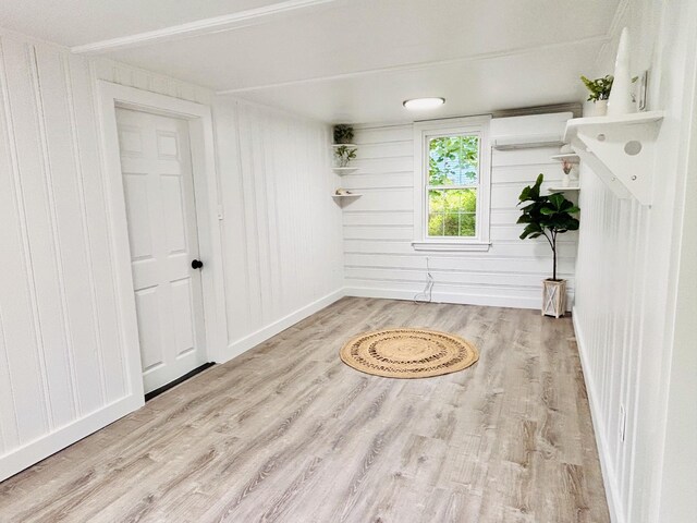 379 Main St, Mashpee, MA 02649 - spare room with wood finished floors, a wall unit AC, and baseboards