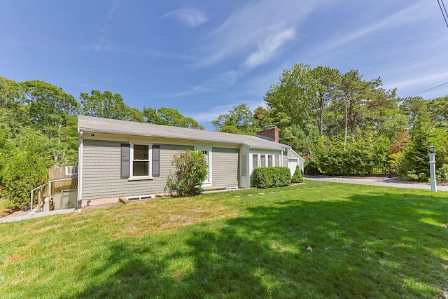 26 Hinckley Cir, Osterville, MA 02655 - view of front of house with a front lawn and a chimney