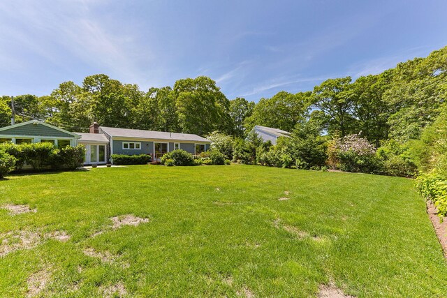 26 Hinckley Cir, Osterville, MA 02655 - view of grassy yard with french doors