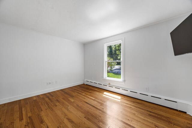 26 Hinckley Cir, Osterville, MA 02655 - unfurnished room featuring baseboard heating and hardwood / wood-style flooring