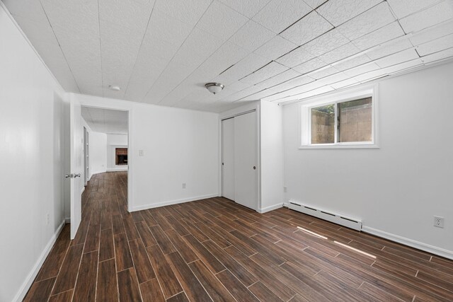 26 Hinckley Cir, Osterville, MA 02655 - empty room with a baseboard heating unit and wood finished floors