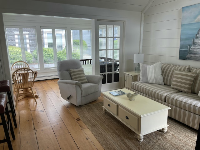 17 Hydrangea Ln, Mashpee, MA 02649 - living room with hardwood / wood-style flooring, baseboard heating, vaulted ceiling, and wood walls