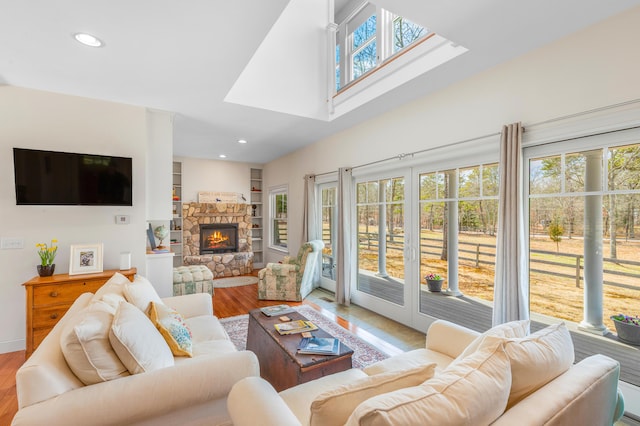 21 Cloverfield Way, Hatchville, MA 02536 - living room featuring light wood-style flooring, a skylight, a fireplace, and recessed lighting