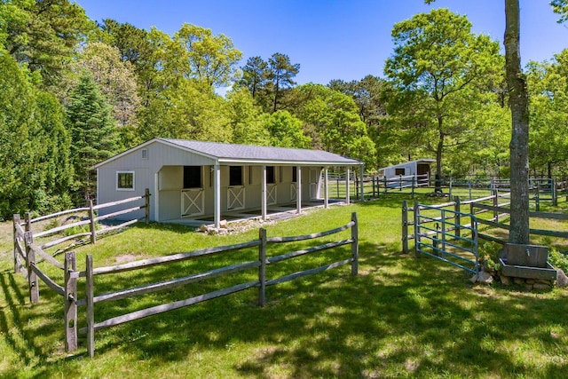 21 Cloverfield Way, Hatchville, MA 02536 - view of front facade with an exterior structure, an outdoor structure, and a wooded view