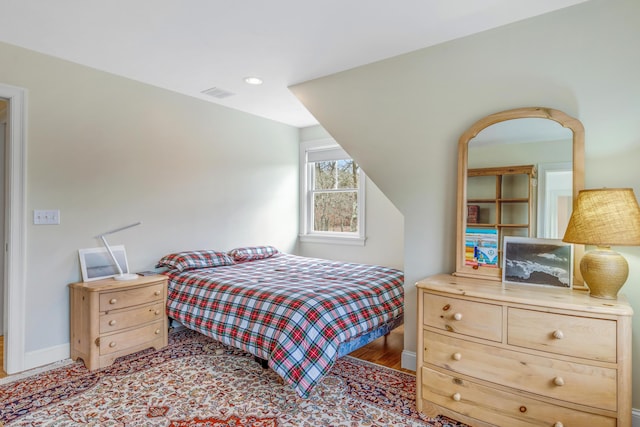 bedroom featuring baseboards, visible vents, and recessed lighting