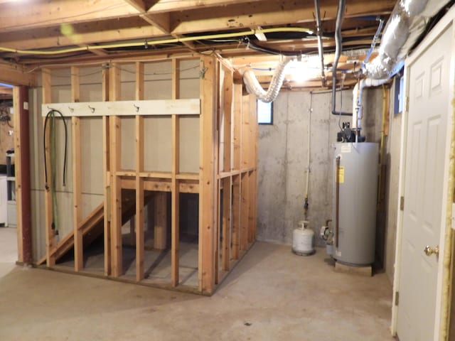 below grade area featuring water heater