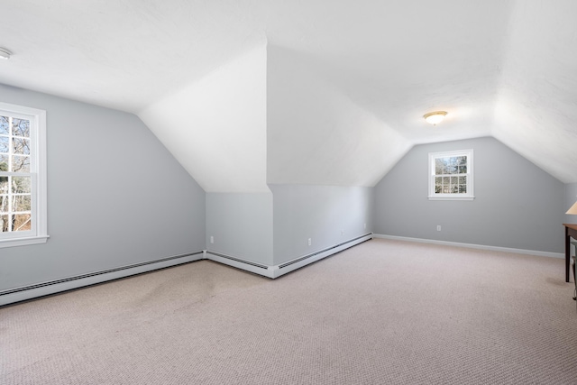 bonus room featuring carpet, vaulted ceiling, and baseboards