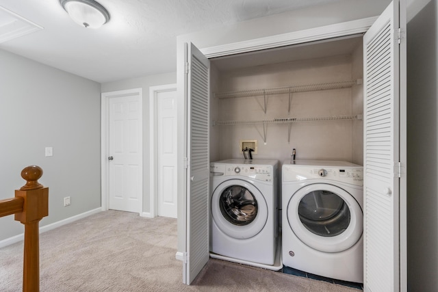 clothes washing area featuring carpet floors, laundry area, baseboards, and independent washer and dryer