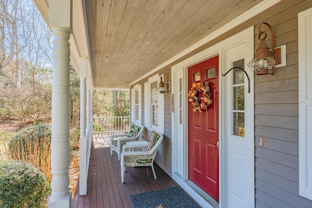 wooden terrace featuring covered porch