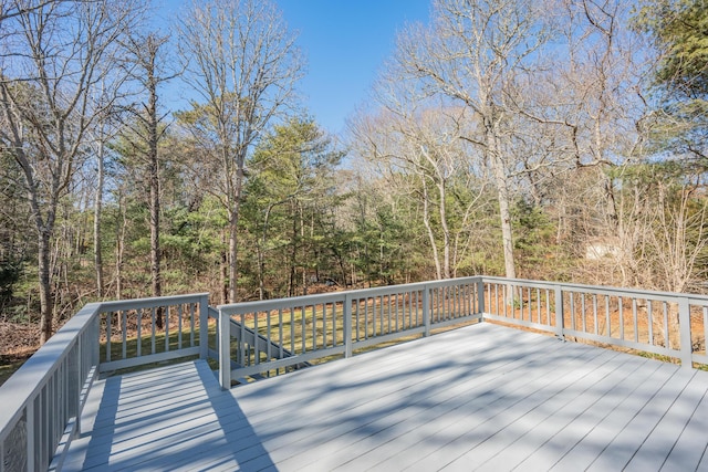 deck featuring a forest view