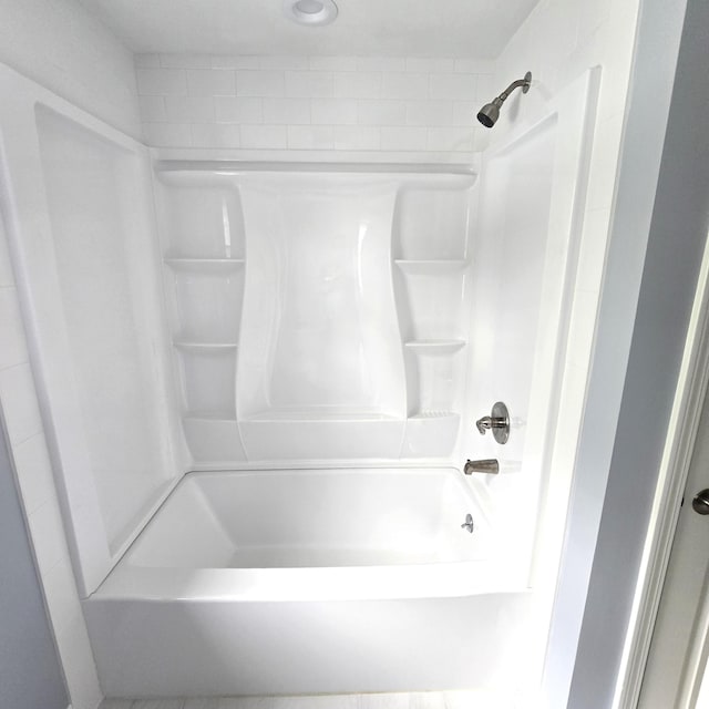 bathroom with shower / washtub combination