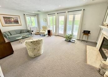92 Cliffside Dr Unit 92, Cedarville, MA 02360 - carpeted living area featuring a fireplace with flush hearth and recessed lighting