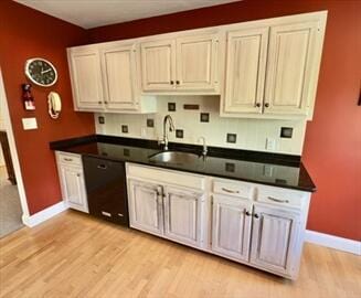 92 Cliffside Dr Unit 92, Cedarville, MA 02360 - kitchen featuring black dishwasher, light wood-type flooring, and dark countertops