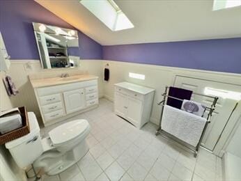 92 Cliffside Dr Unit 92, Cedarville, MA 02360 - bathroom featuring lofted ceiling, a wainscoted wall, a skylight, and vanity