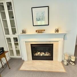 92 Cliffside Dr Unit 92, Cedarville, MA 02360 - detailed view of a fireplace with flush hearth and carpet