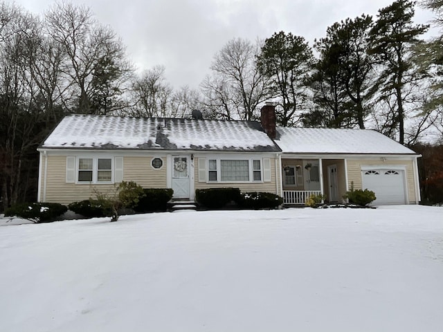 95 Anchor Ln, Cotuit, MA 02635 - view of front of home with a chimney, a garage, entry steps, and covered porch
