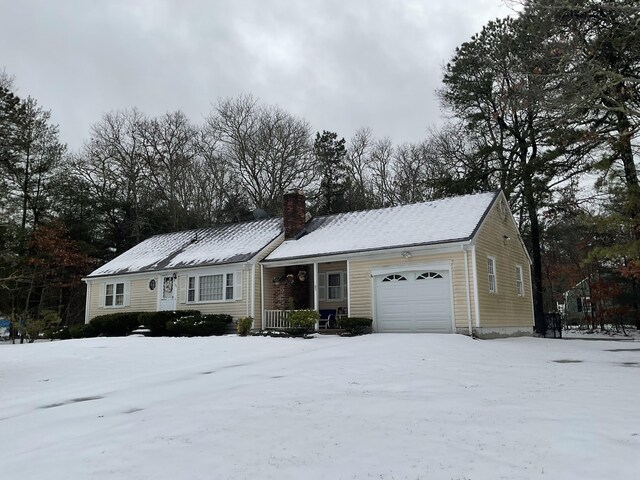 95 Anchor Ln, Cotuit, MA 02635 - view of front of property featuring a garage, a chimney, and a porch