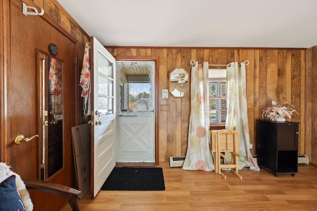 95 Anchor Ln, Cotuit, MA 02635 - entrance foyer with a baseboard radiator, wooden walls, and light wood finished floors