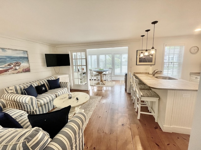 25 Milestone Way, Mashpee, MA 02649 - living room featuring wood-type flooring and a chandelier
