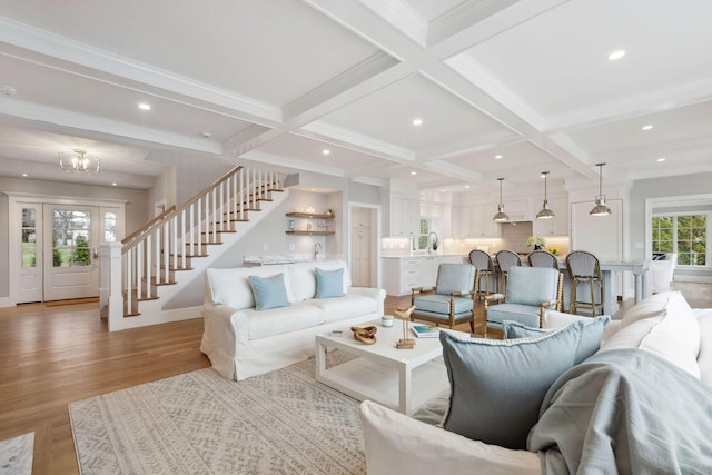 44 Tonset Rd, Orleans, MA 02653 - living room featuring beamed ceiling, light wood-style flooring, coffered ceiling, and stairs
