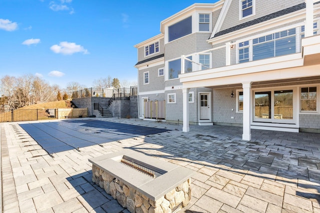 view of swimming pool with a patio area and fence