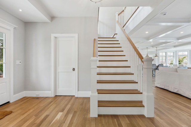 44 Tonset Rd, Orleans, MA 02653 - staircase featuring beamed ceiling, recessed lighting, wood finished floors, coffered ceiling, and baseboards