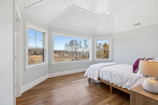 44 Tonset Rd, Orleans, MA 02653 - bedroom featuring visible vents, multiple windows, wood finished floors, and lofted ceiling