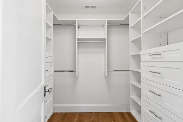 44 Tonset Rd, Orleans, MA 02653 - walk in closet with visible vents and dark wood-style flooring
